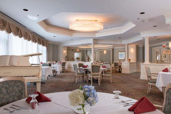 Elegant dining room with tables set for guests