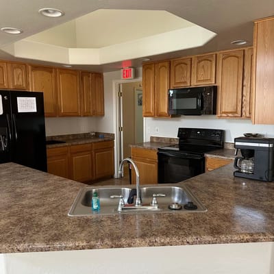 Modern kitchen with wood cabinetry and appliances