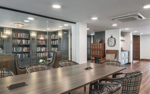 Interior view of a communal reading area with bookshelves