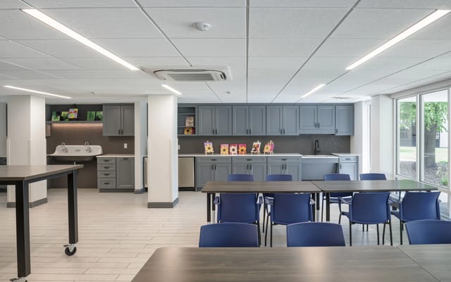 Bright common area with tables and chairs