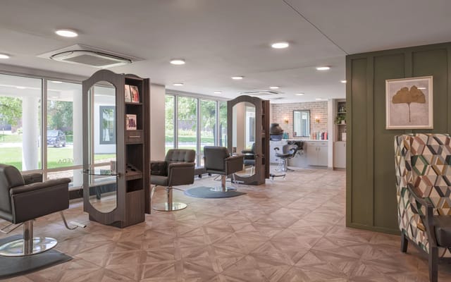 Salon area with styling chairs and mirrors