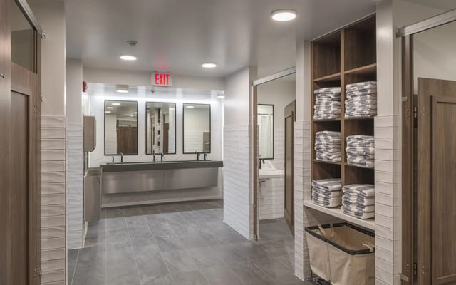 Bright and modern restroom with towels and sinks