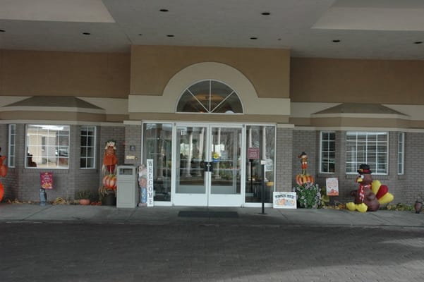 Front entrance of a senior living facility with decorations