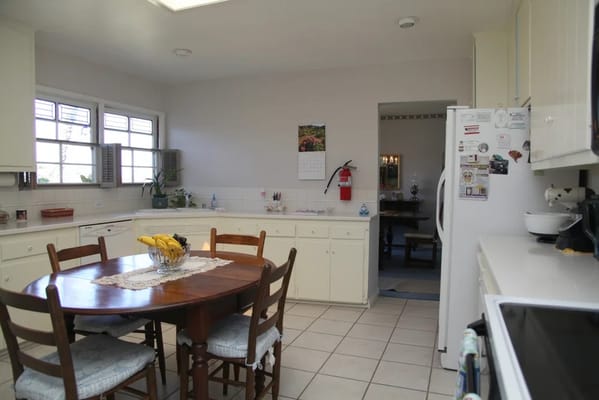Bright kitchen area with a dining table