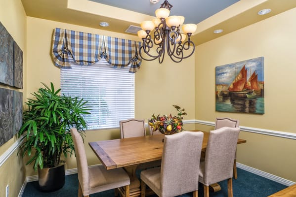 Bright dining area with a wooden table and chairs