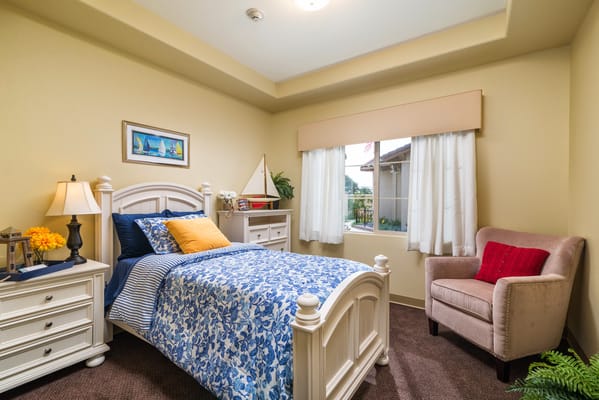 Private bedroom with bedding and window view