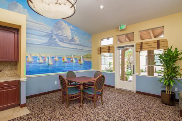 Interior room with a nautical mural and table