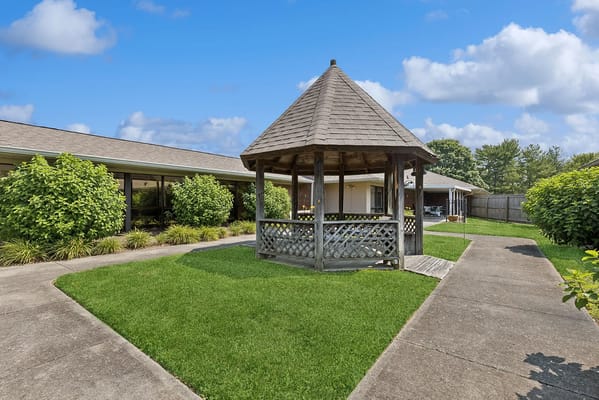 Outdoor gazebo in a landscaped area