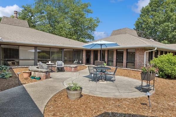 Outdoor seating area with tables and umbrellas