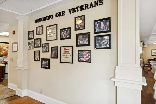 Wall honoring veterans with photos and flags