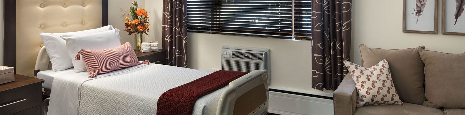 Cozy resident room with bed and seating area