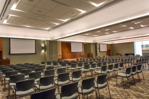 Interior view of a conference room with rows of chairs
