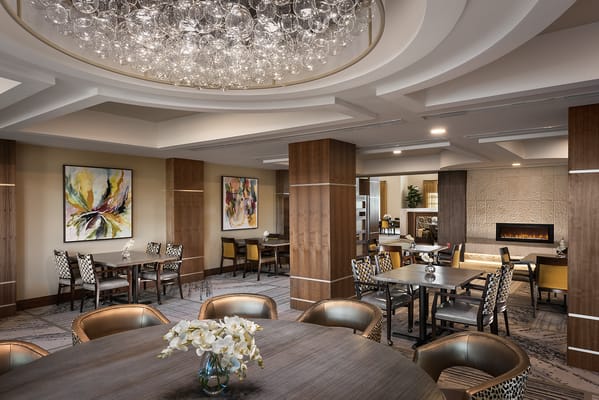 Elegant dining room with decorative lighting and artwork