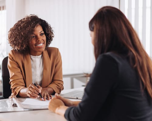 Staff member interacting with a resident during a consultation