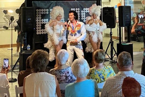 Residents enjoying a live performance with entertainers
