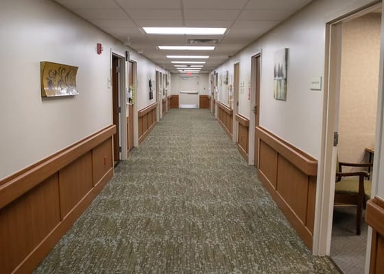 Corridor inside a nursing home facility with artwork