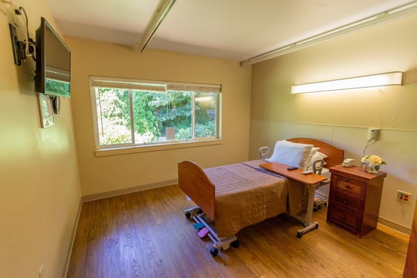 Private resident room with bed and window