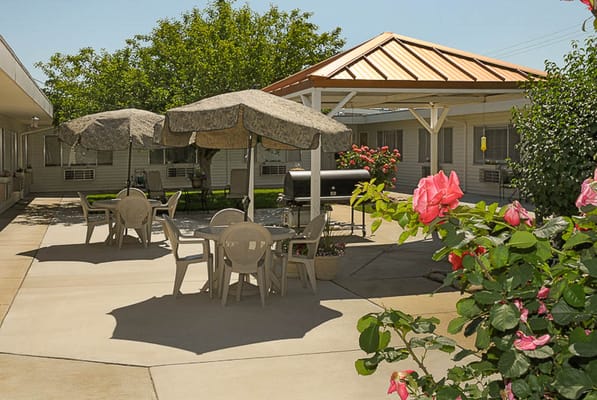 Outdoor seating area with tables and umbrellas