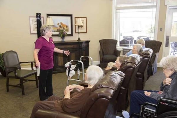 Residents enjoying a group activity in a cozy lounge