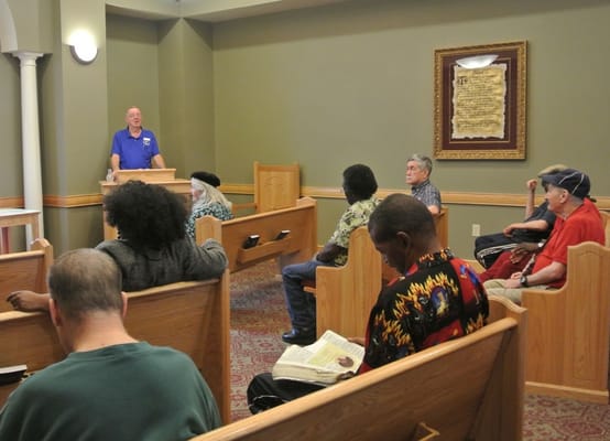 Residents attending a service in a common area
