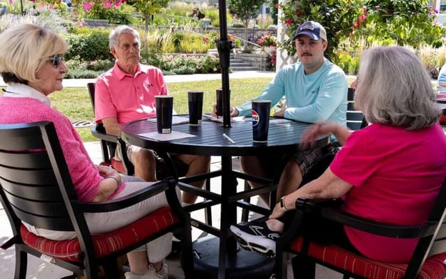 Residents chatting in an outdoor setting
