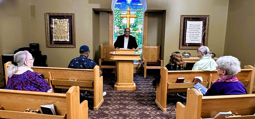 Residents participating in a spiritual service in a chapel