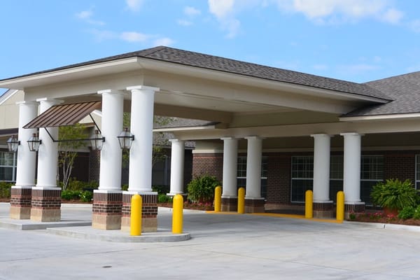 Exterior view of Magnolia Manor entrance with covered area
