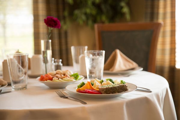 Elegant dining table setting with meals