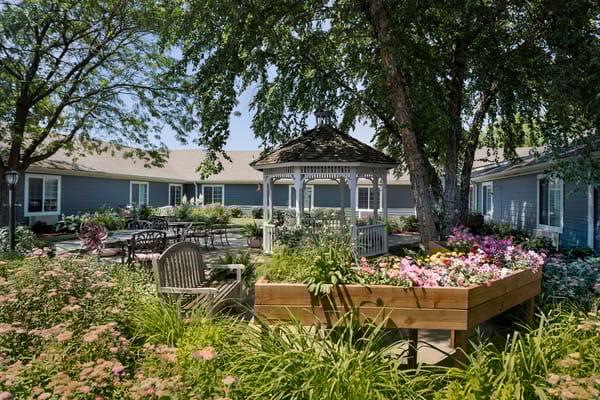 A beautifully landscaped outdoor garden area with gazebo