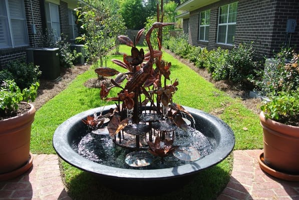 A decorative water fountain in the garden area