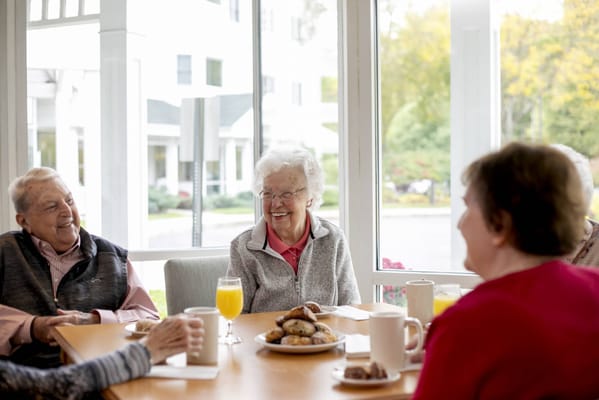 Residents enjoying snacks and drinks in a common area