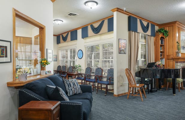 Cozy common area with seating and piano