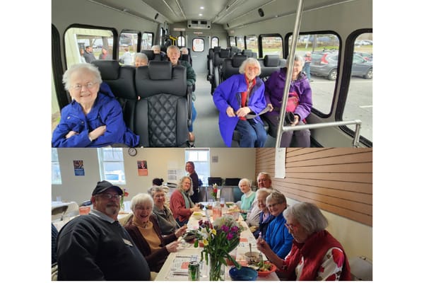 Residents enjoying a meal and socializing in a dining area
