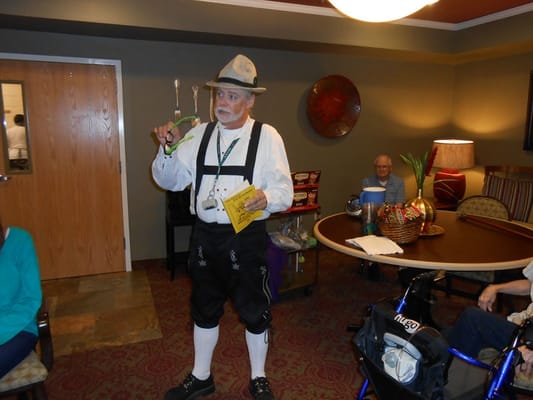 A performer entertaining residents in a common area.