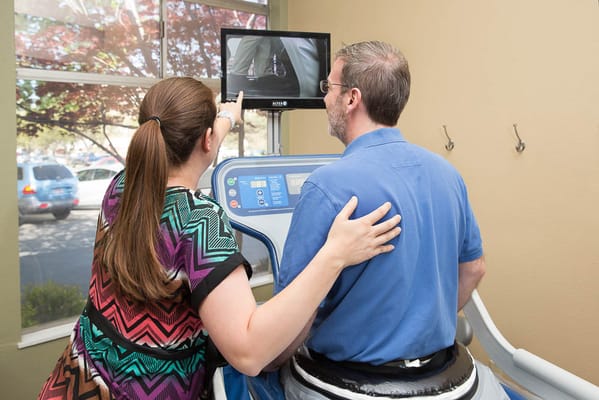 Staff assisting a resident during therapy session
