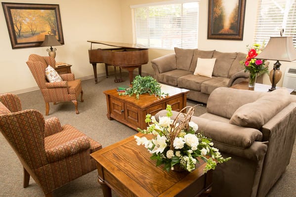 Cozy common area with seating and piano