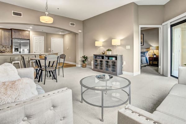 Bright common area with seating and dining space