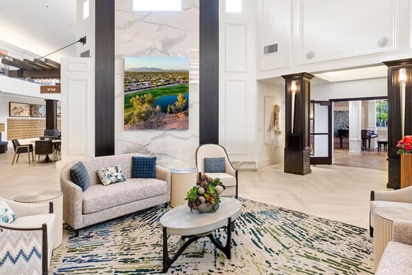 Bright common area with seating and artwork