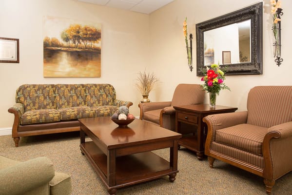 Cozy lounge area with seating and floral decor