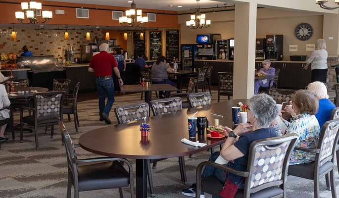 Residents enjoying a meal in the dining area