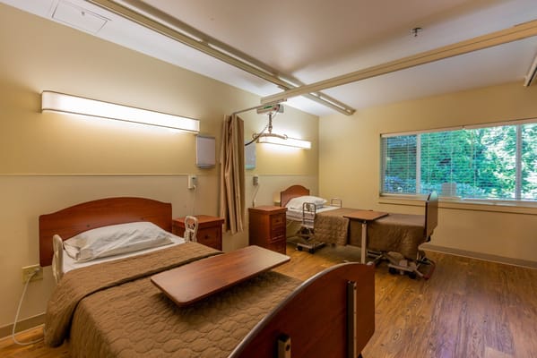 Interior view of a shared bedroom in a rehabilitation center