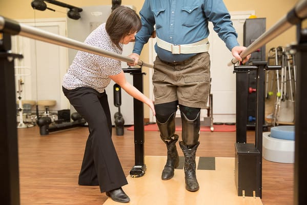 Therapist assisting a resident during rehabilitation