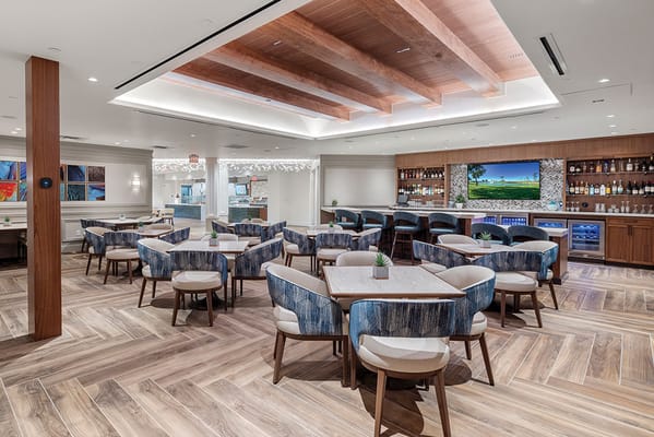 Bright dining room with modern furniture and wood accents