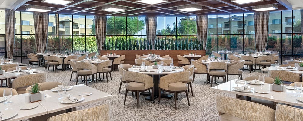 Elegant dining room setup with tables and chairs