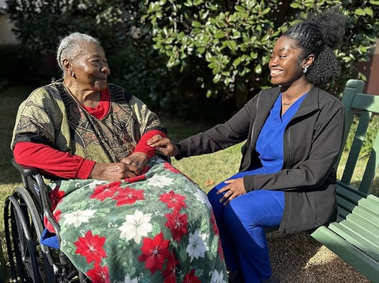 Resident and staff member enjoying time outdoors
