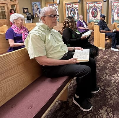 Residents participating in a group activity in a chapel