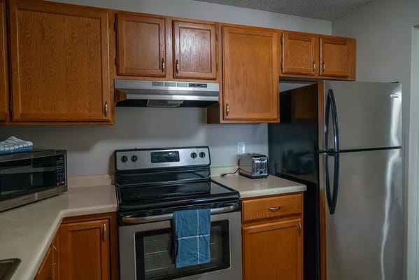 A well-equipped kitchen in an assisted living apartment