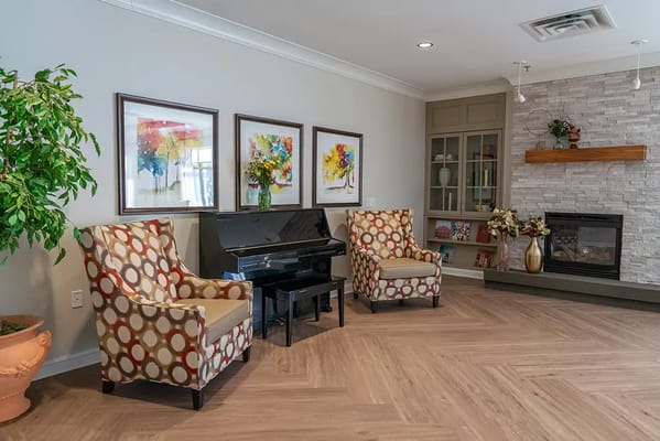 Cozy lounge area with armchairs and piano