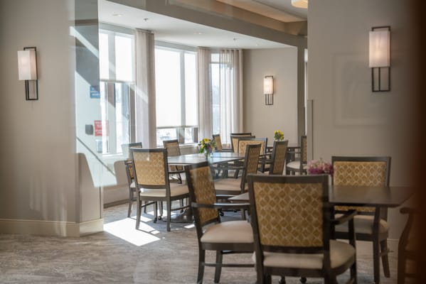 Interior dining area with tables and flowers