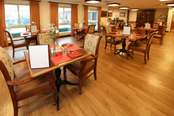 Dining area with tables and wooden chairs